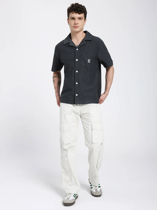Grey Textured Bowling Shirt by DVRZI worn by a model, showcasing a relaxed fit and stylish design.